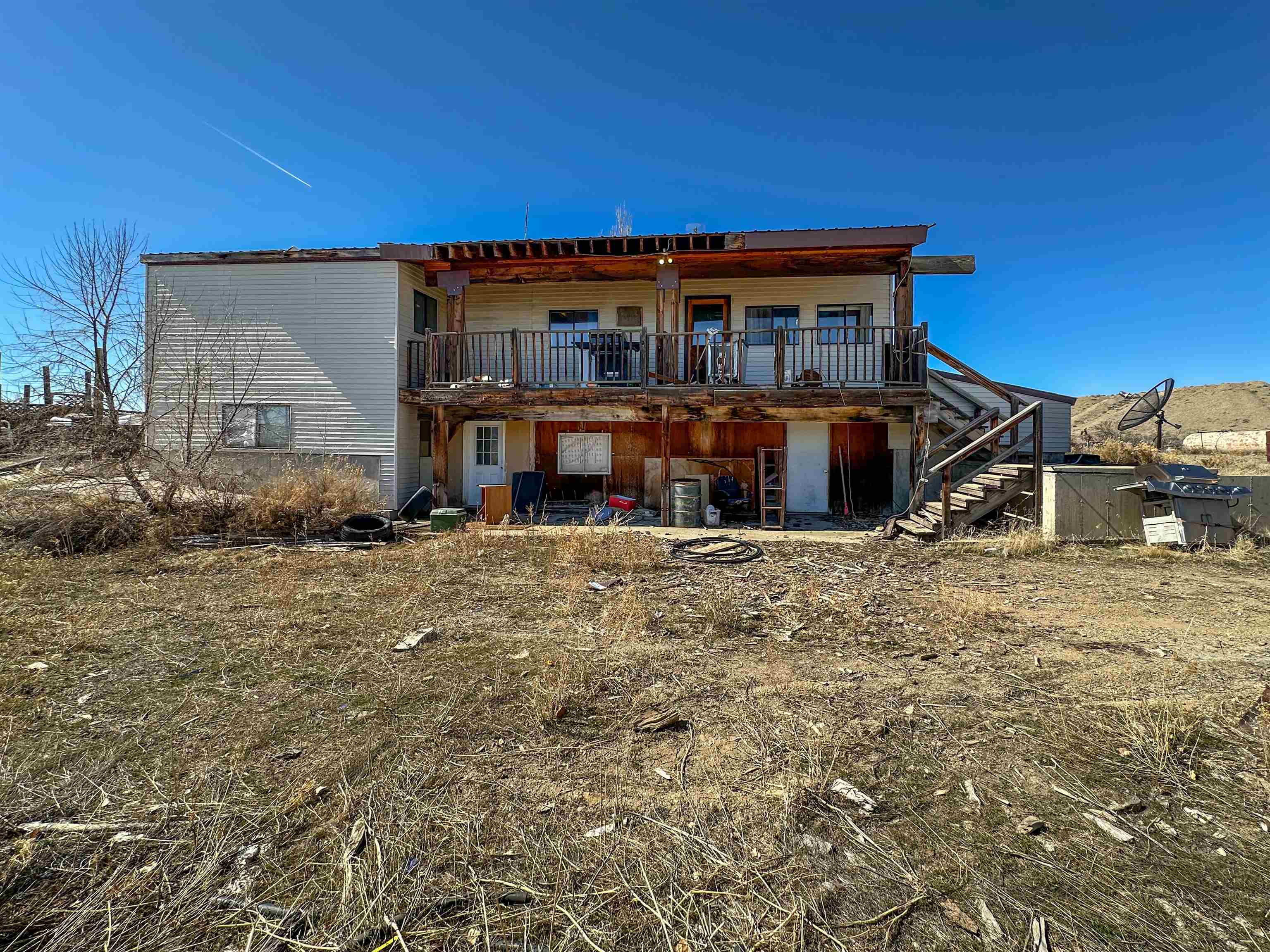 1818 County Road 46 Rangely, CO 81648 - Photo 20 of 23 front view of a house with a big yard