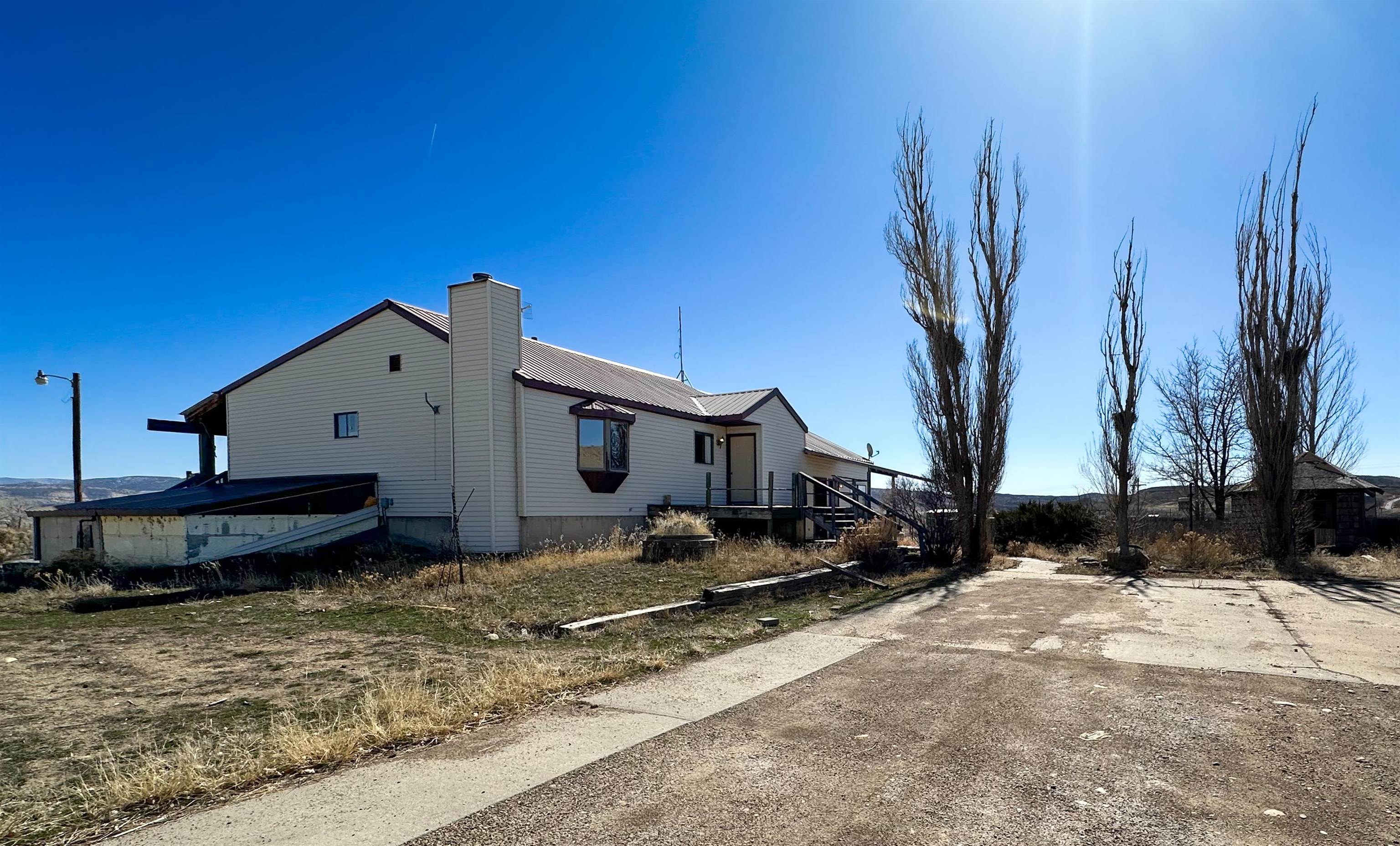 1818 County Road 46 Rangely, CO 81648 - Photo 2 of 23 a house view with a backyard space
