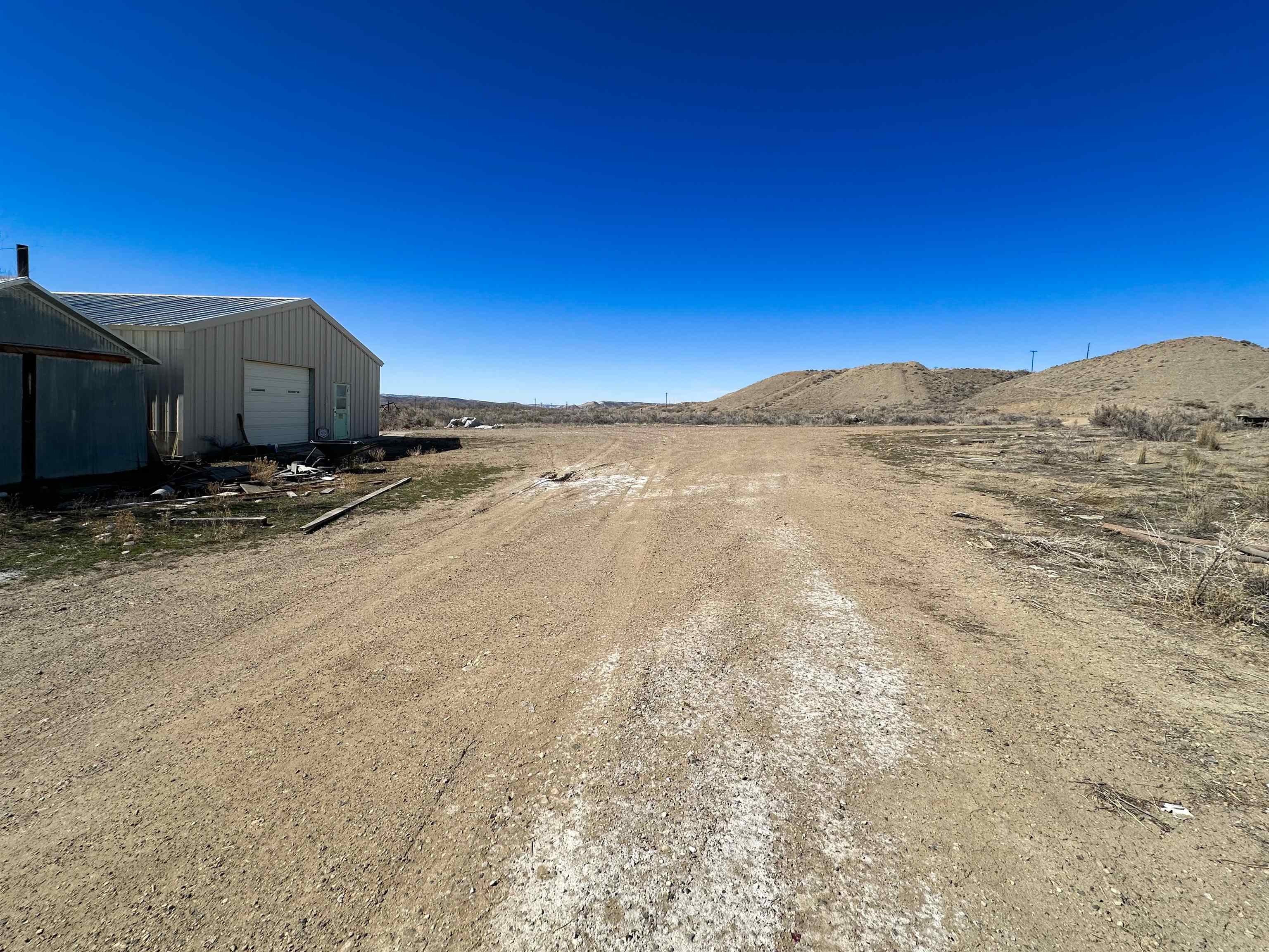 1818 County Road 46 Rangely, CO 81648 - Photo 4 of 23 a view of an outdoor space and a mountain view