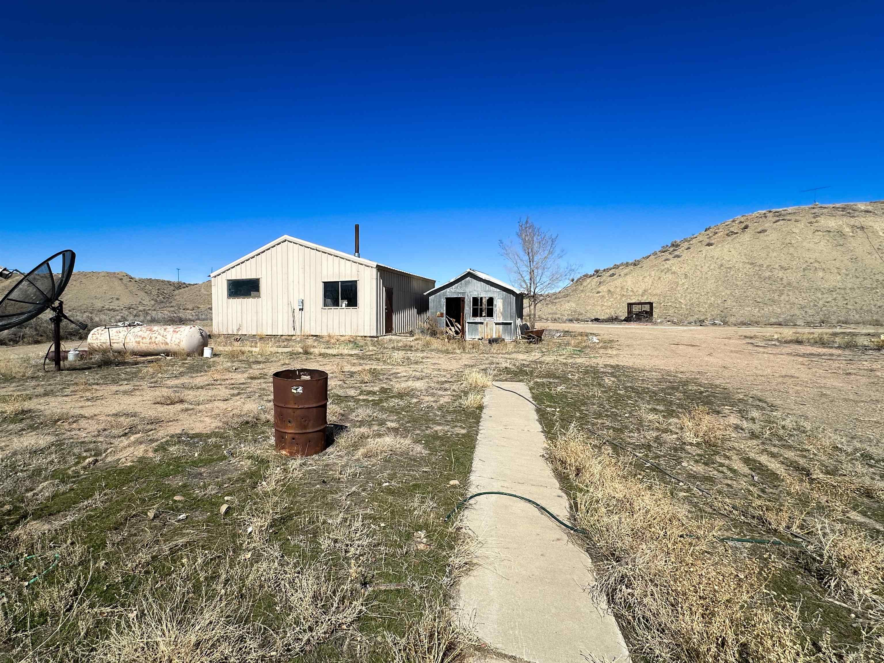 1818 County Road 46 Rangely, CO 81648 - Photo 6 of 23 a view of a house with a yard
