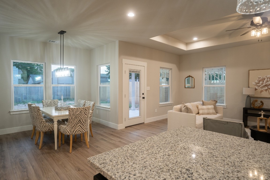 307 String Prairie Way Smithville, TX 78957 - Photo 14 of 34 Dining space with light wood-style floors, baseboards, plenty of natural light, ceiling fan, and recessed lighting