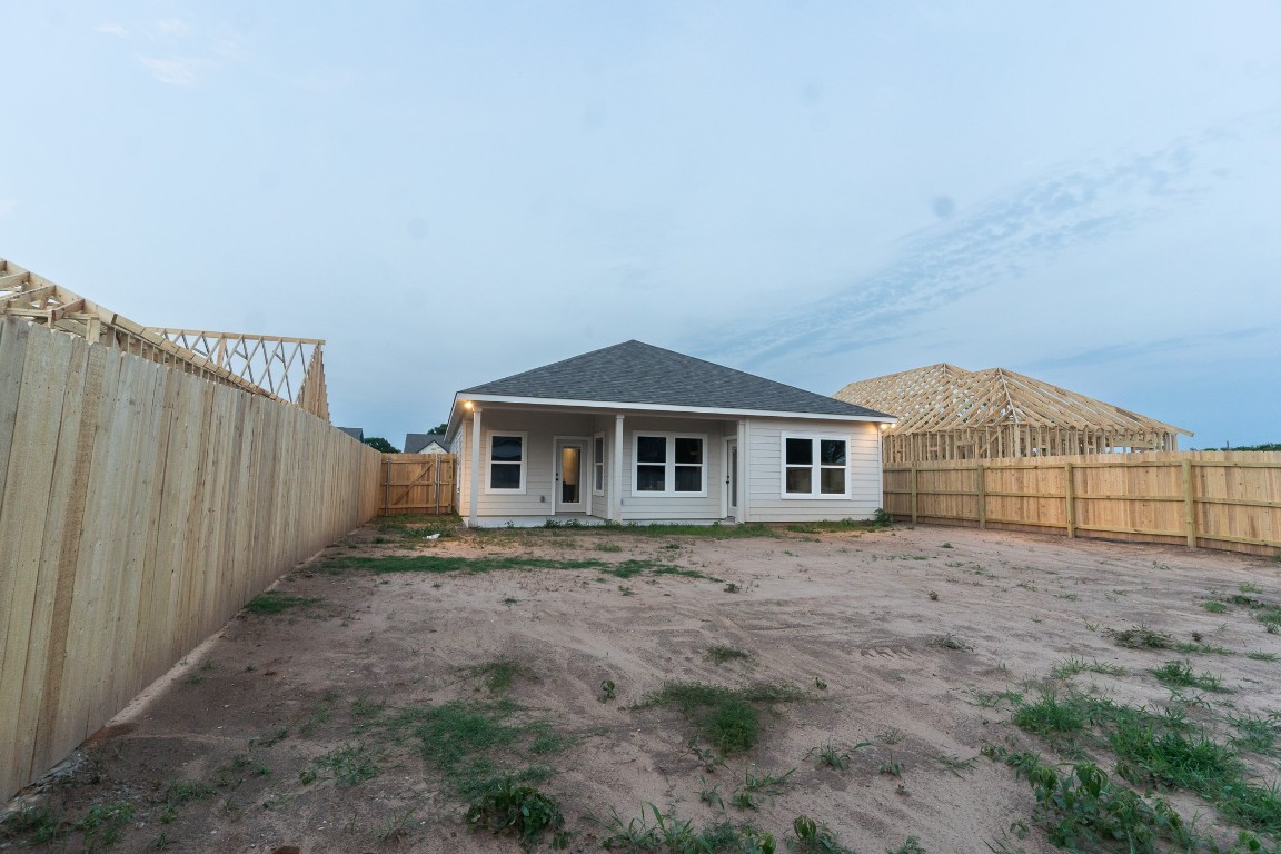 307 String Prairie Way Smithville, TX 78957 - Photo 31 of 34 Rear view of house featuring a fenced backyard