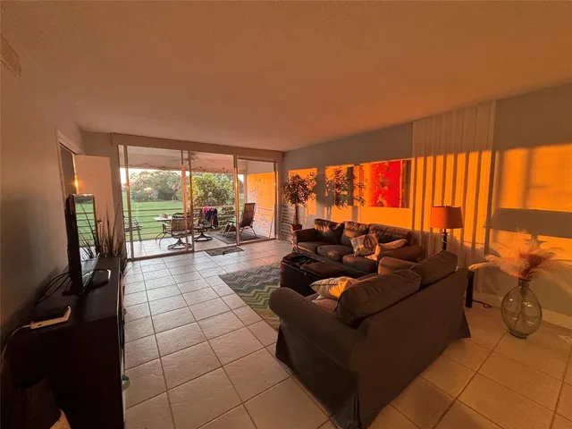 a view of a swimming pool with an outdoor space and seating area