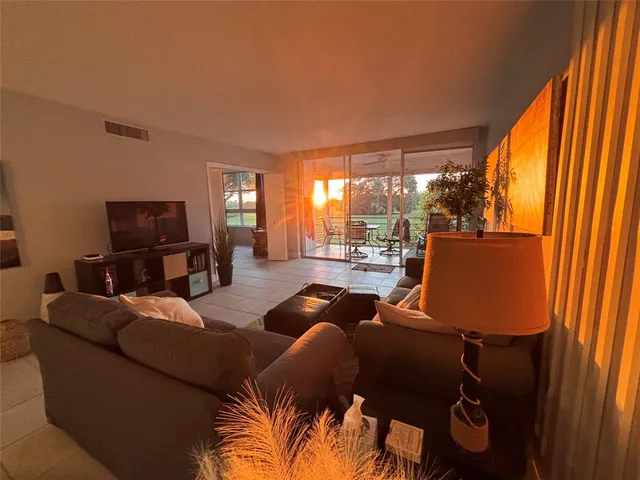 a view of a roof deck with table and chairs