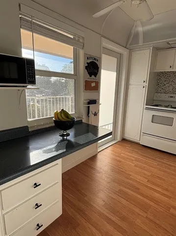a bedroom with a bed and painting on the wall