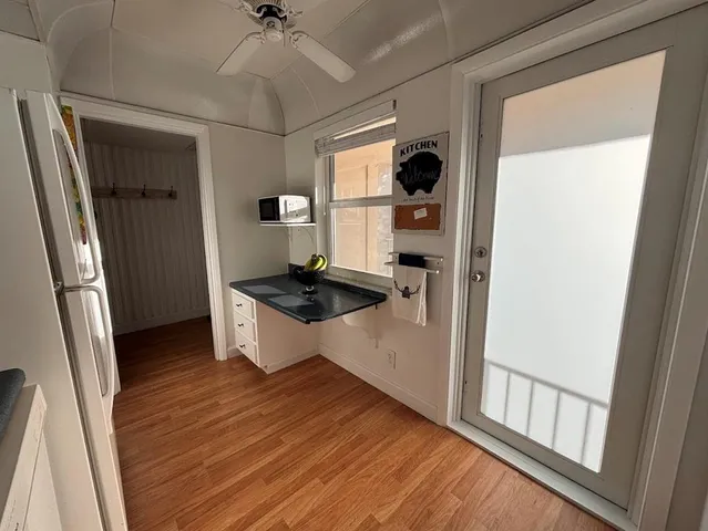 a bedroom with a bed dresser and a window