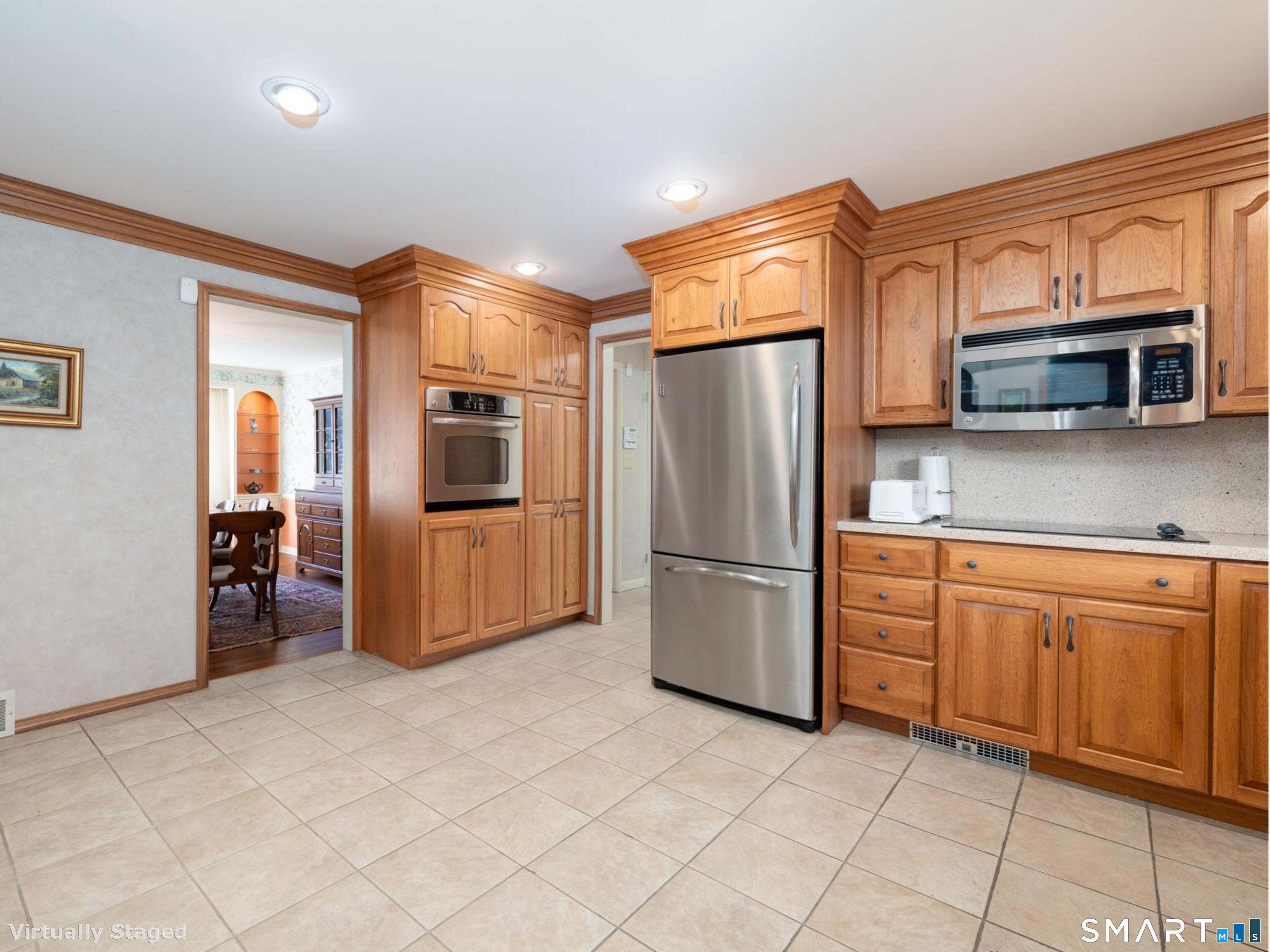 117 Crest Road Middlebury, CT 06762 - Photo 11 of 38 Stainless steel appliances, cook top, wall oven built-in microwave and more.