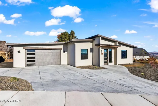 a front view of a house with yard