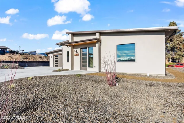 an empty room with windows and entrance