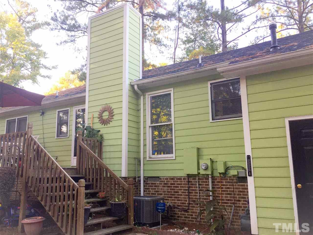 3422 Freeman Road Durham, NC 27703 - Photo 3 of 15 a view of a house with a window and wooden fence