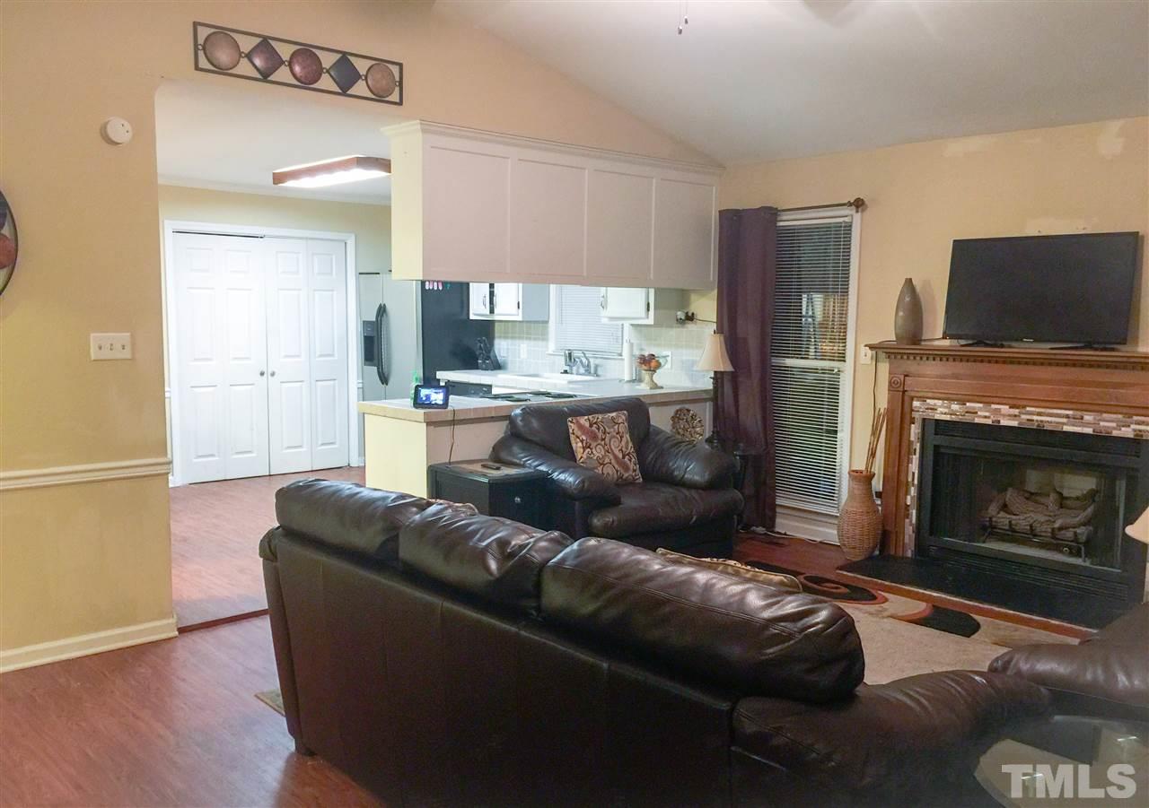3422 Freeman Road Durham, NC 27703 - Photo 5 of 15 a living room with furniture and a fireplace