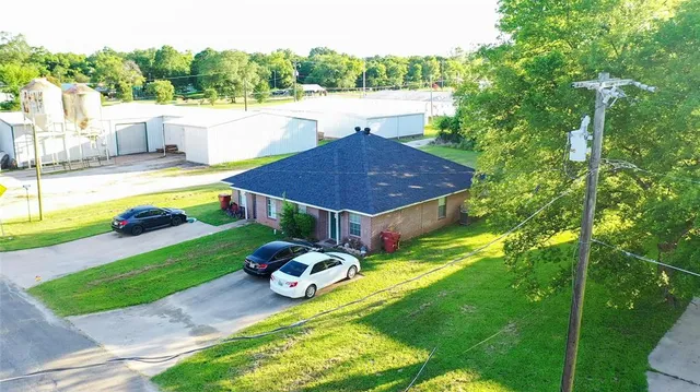 a swimming pool view with a outdoor seating