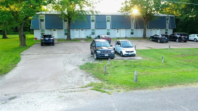 a view of a backyard with sitting area and fire pit