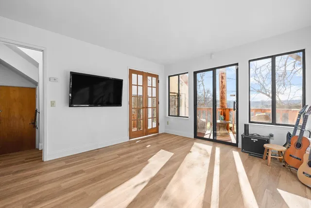 a view of livingroom with furniture flat screen tv and staircase