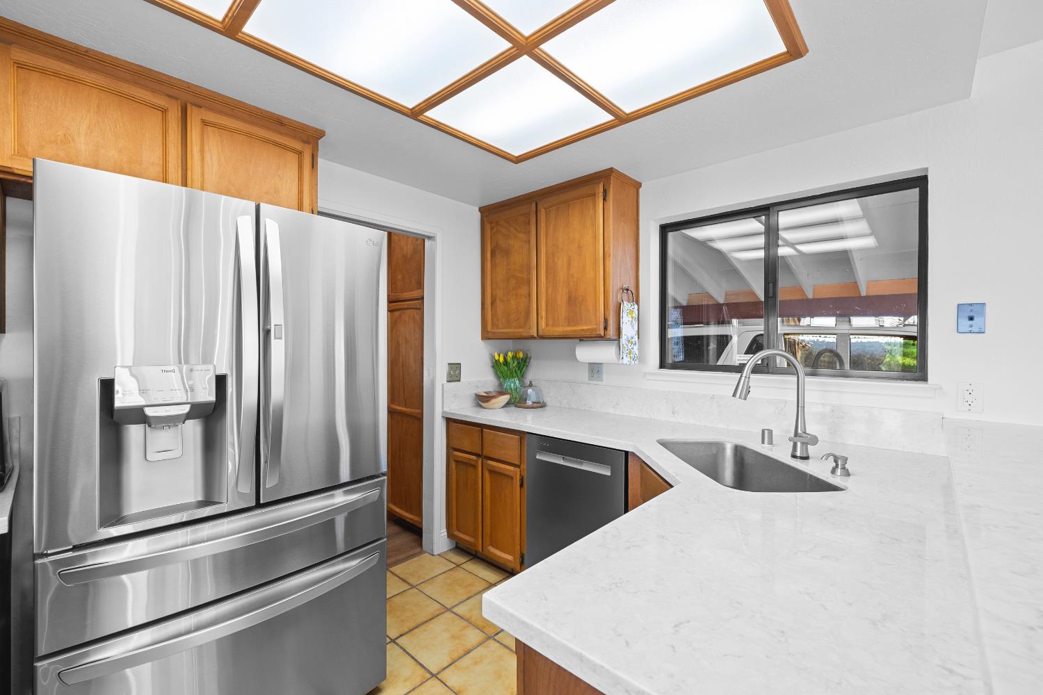 11700 Quail Road Auburn, CA 95602 - Photo 7 of 44 Kitchen with new quartz counters and appliances.