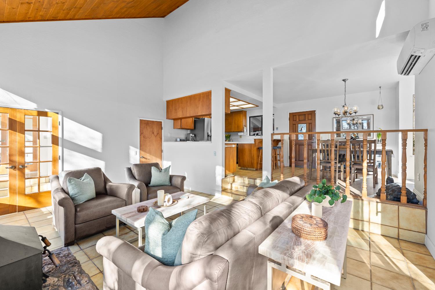 11700 Quail Road Auburn, CA 95602 - Photo 9 of 44 Living room looking towards kitchen, dining and to the sunroom to the left.
