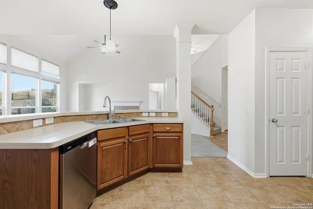 a large bathroom with a sink and a large mirror