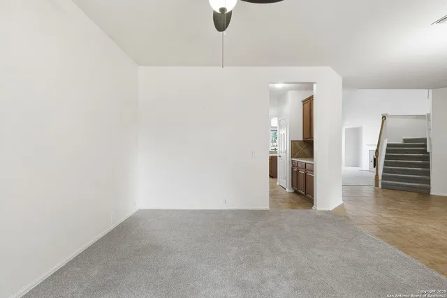 a view of empty room with stairs