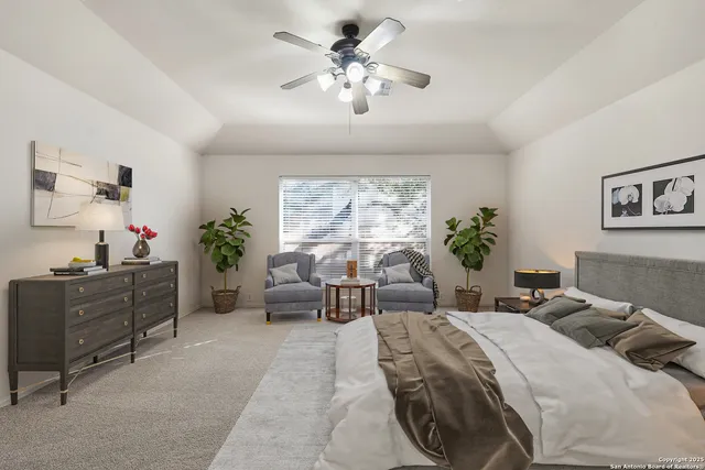 a bedroom with a bed and a couch