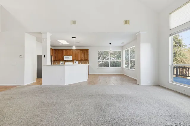a view of a kitchen with a sink and a window