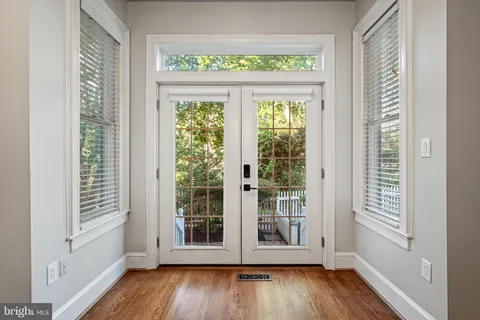 a view of room with window and wooden floor