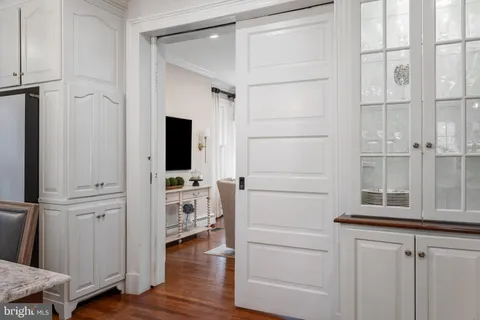 a view of an entryway with wooden floor