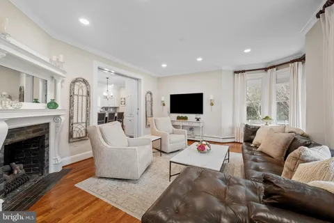 a living room with a fireplace and a fireplace