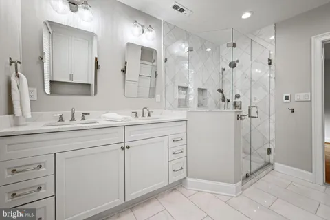 a view of a grassy field with trees in the background