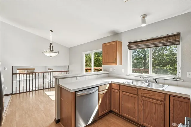 a kitchen that has a sink and a large window
