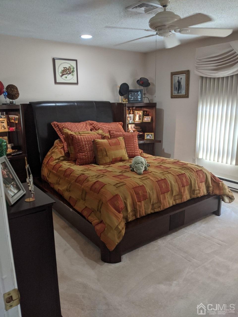 230 Convent Road, Unit A Monroe Township, NJ 08831 - Photo 13 of 22 a bedroom with a bed and dresser
