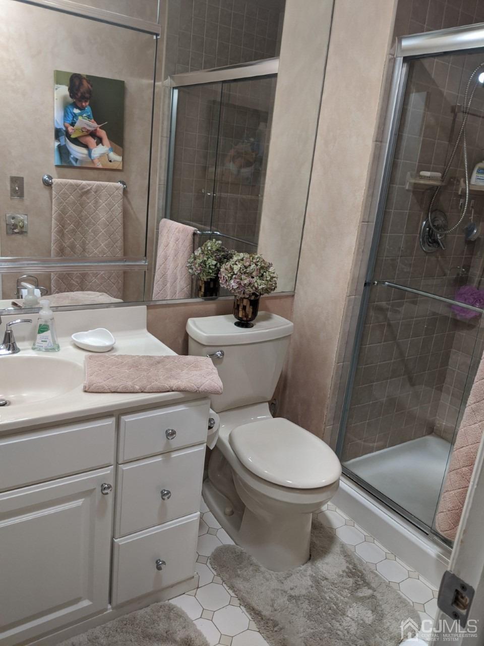 230 Convent Road, Unit A Monroe Township, NJ 08831 - Photo 14 of 22 a bathroom with a granite countertop toilet sink and shower