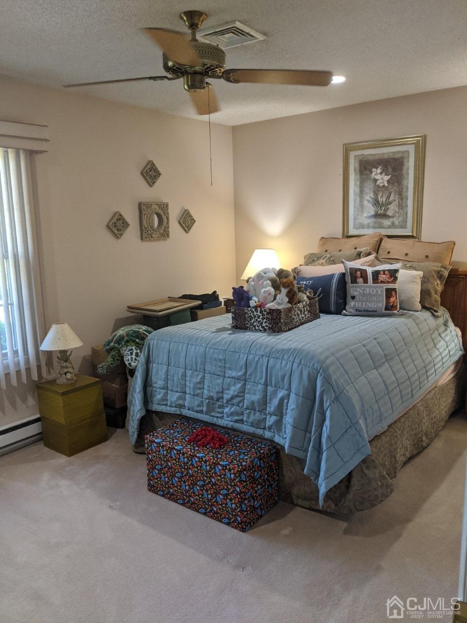 230 Convent Road, Unit A Monroe Township, NJ 08831 - Photo 16 of 22 a bedroom with a bed and window