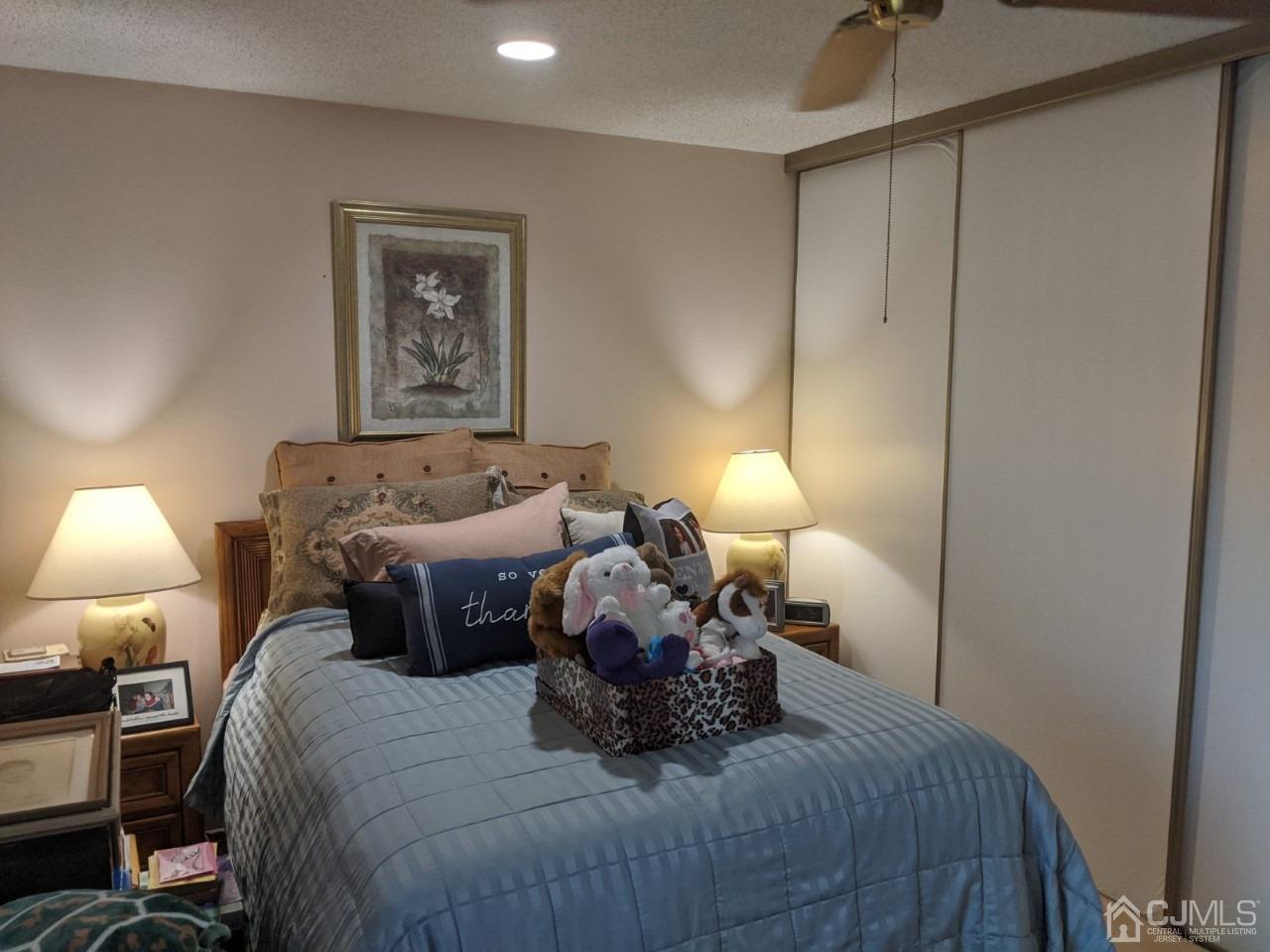 230 Convent Road, Unit A Monroe Township, NJ 08831 - Photo 17 of 22 a bedroom with a bed and a night stand