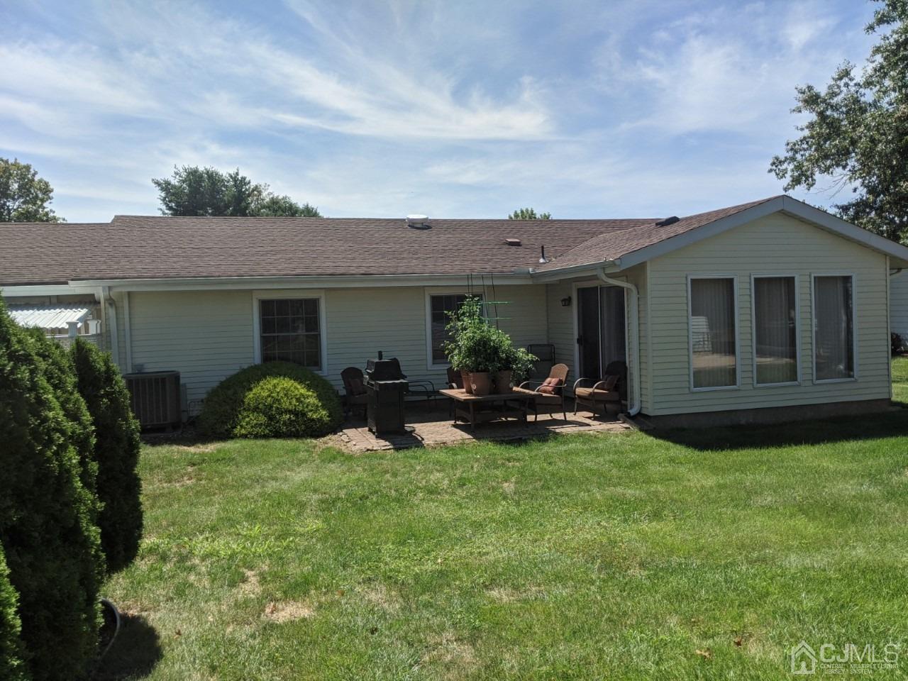 230 Convent Road, Unit A Monroe Township, NJ 08831 - Photo 3 of 22 a view of a house with backyard sitting area and garden