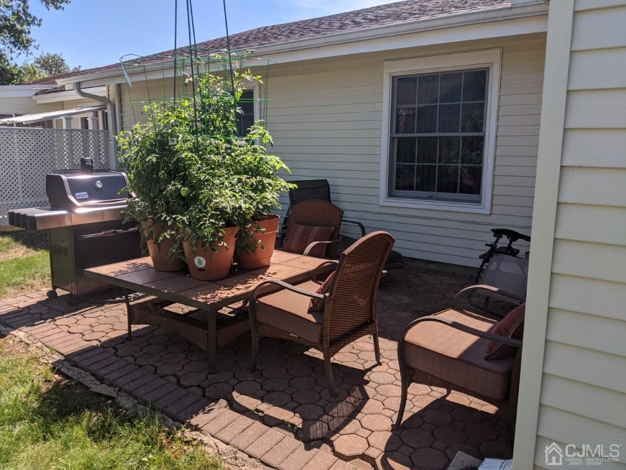 230 Convent Road, Unit A Monroe Township, NJ 08831 - Photo 22 of 22 a couple of chairs sitting in front of a house