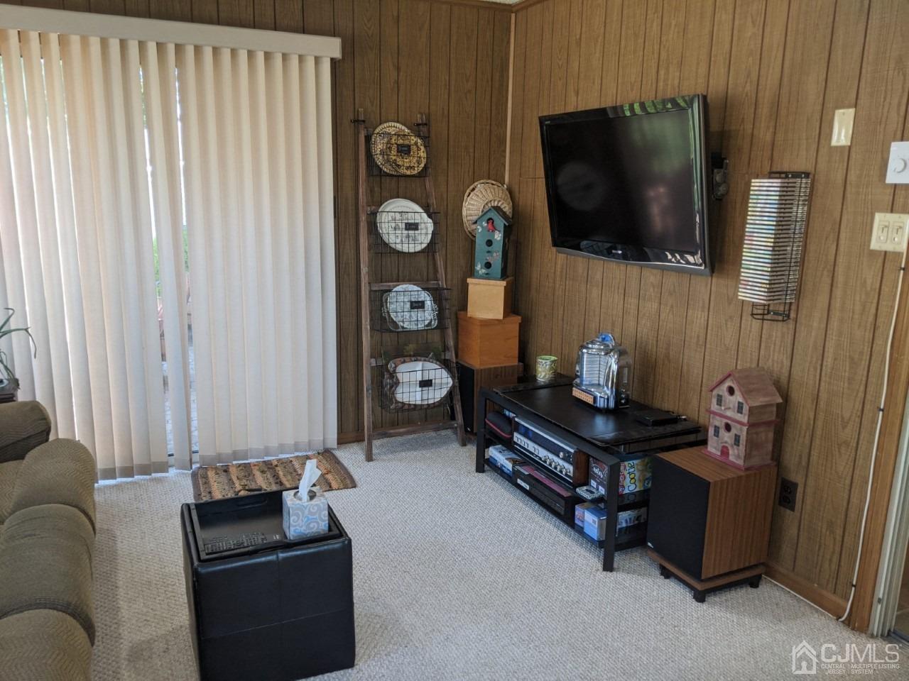 230 Convent Road, Unit A Monroe Township, NJ 08831 - Photo 9 of 22 a living room with furniture and a flat screen tv