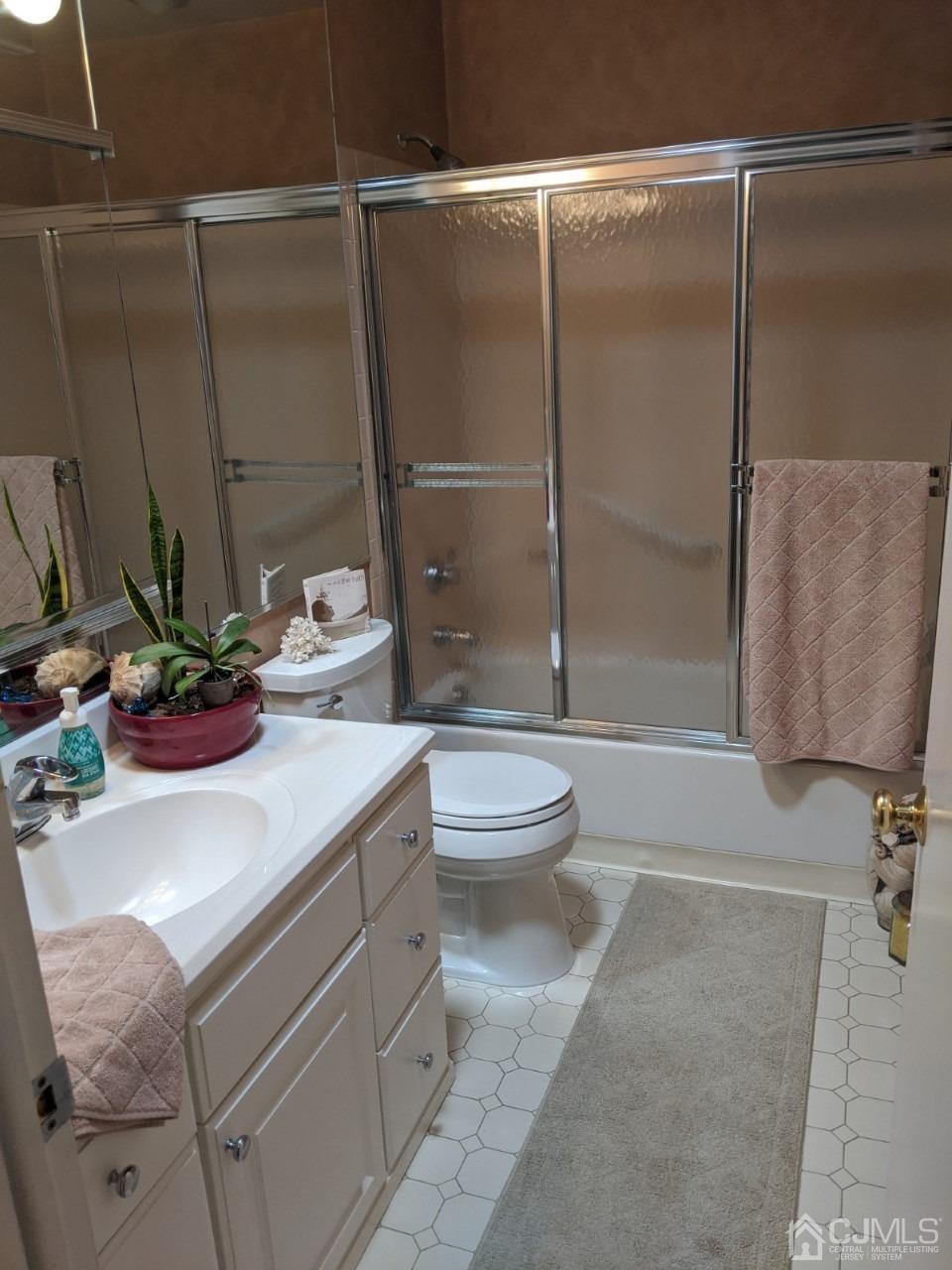 230 Convent Road, Unit A Monroe Township, NJ 08831 - Photo 10 of 22 a bathroom with a sink toilet and shower