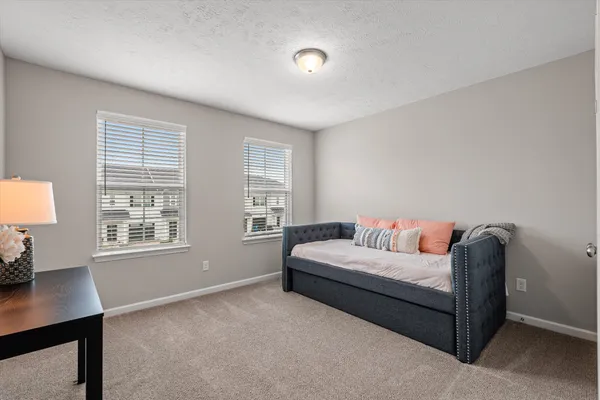 a living room with furniture and windows