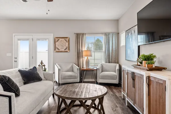 a living room with furniture and a large window