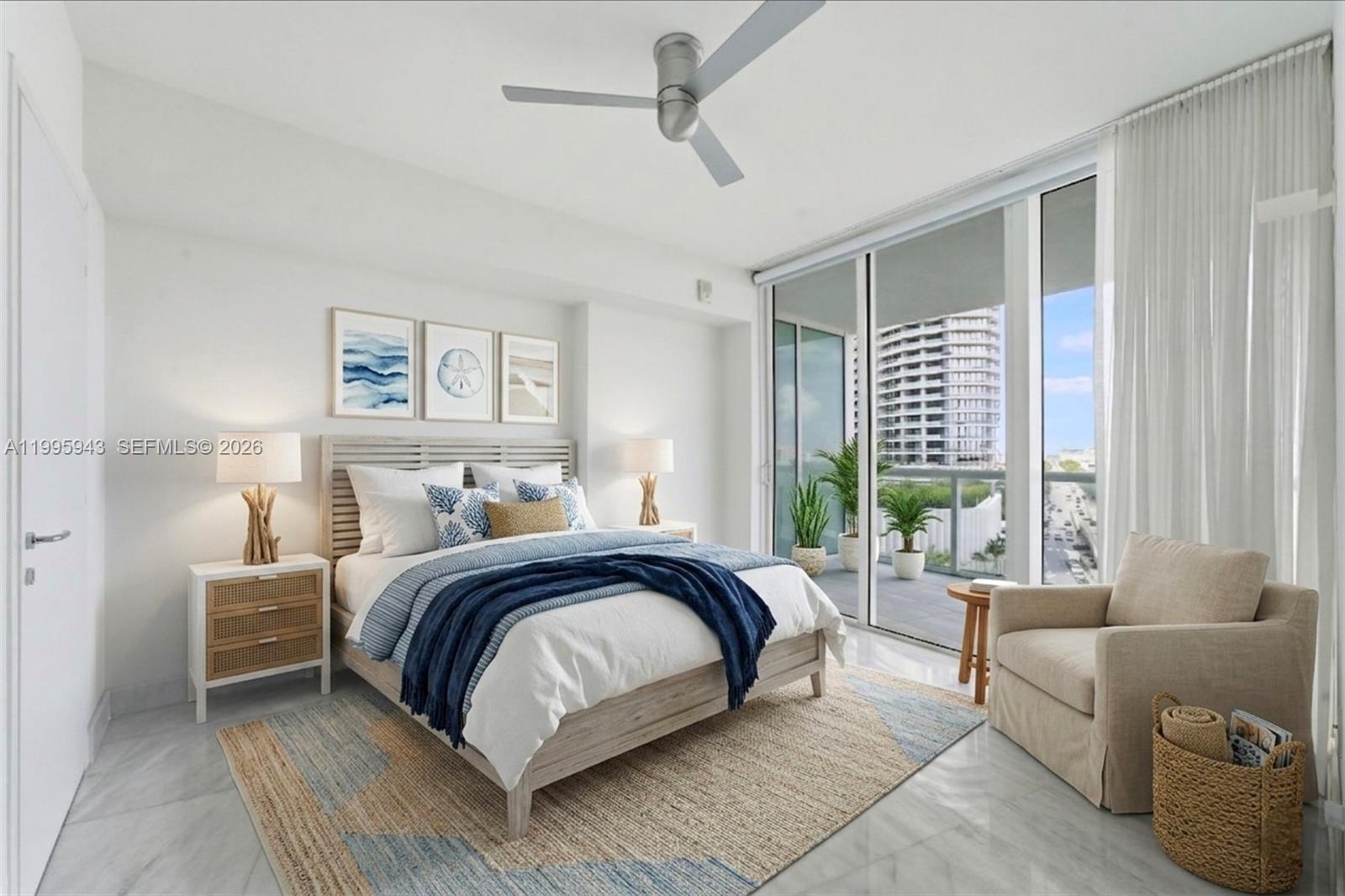 450 Alton Road, Unit 910 Miami Beach, FL 33139 - Photo 19 of 59 a spacious bedroom with a bed couch and a window