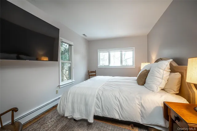 a bathroom with a sink and mirror with toilet