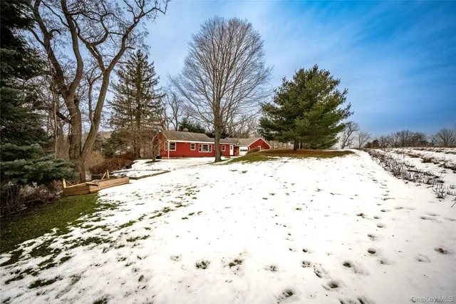 a sign board on the side of a street