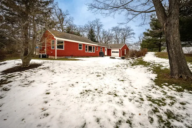 a view of a yard with a tree