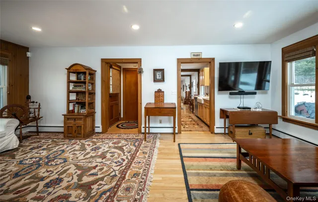 a view of a dining room with furniture and wooden floor