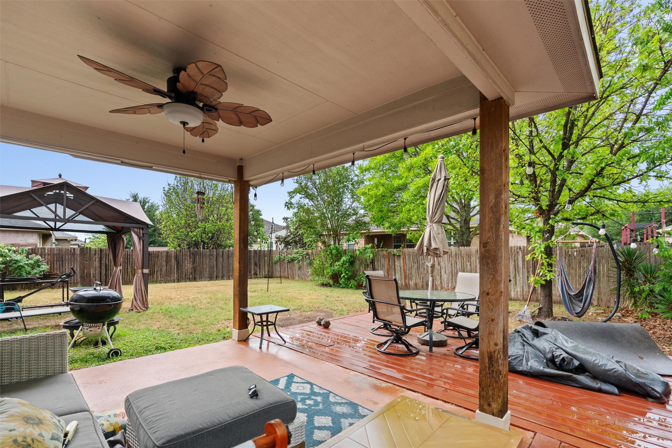 11917 Lansdowne Road Austin, TX 78754 - Photo 15 of 20 This inviting outdoor space features a covered patio and a lush, fenced yard, perfect for relaxation.