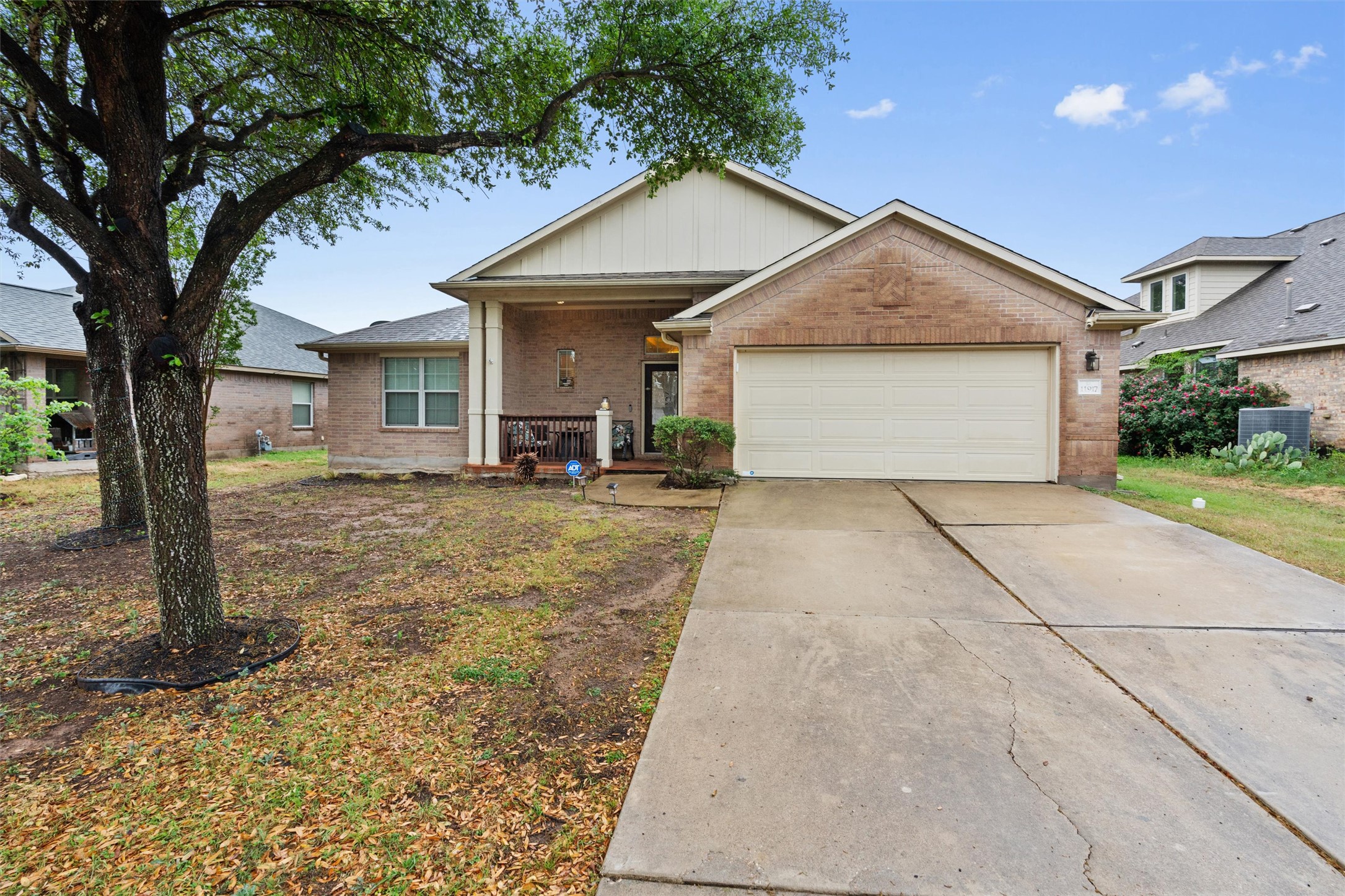 11917 Lansdowne Road Austin, TX 78754 - Photo 19 of 20 This charming home offers a convenient attached garage and a welcoming front porch.