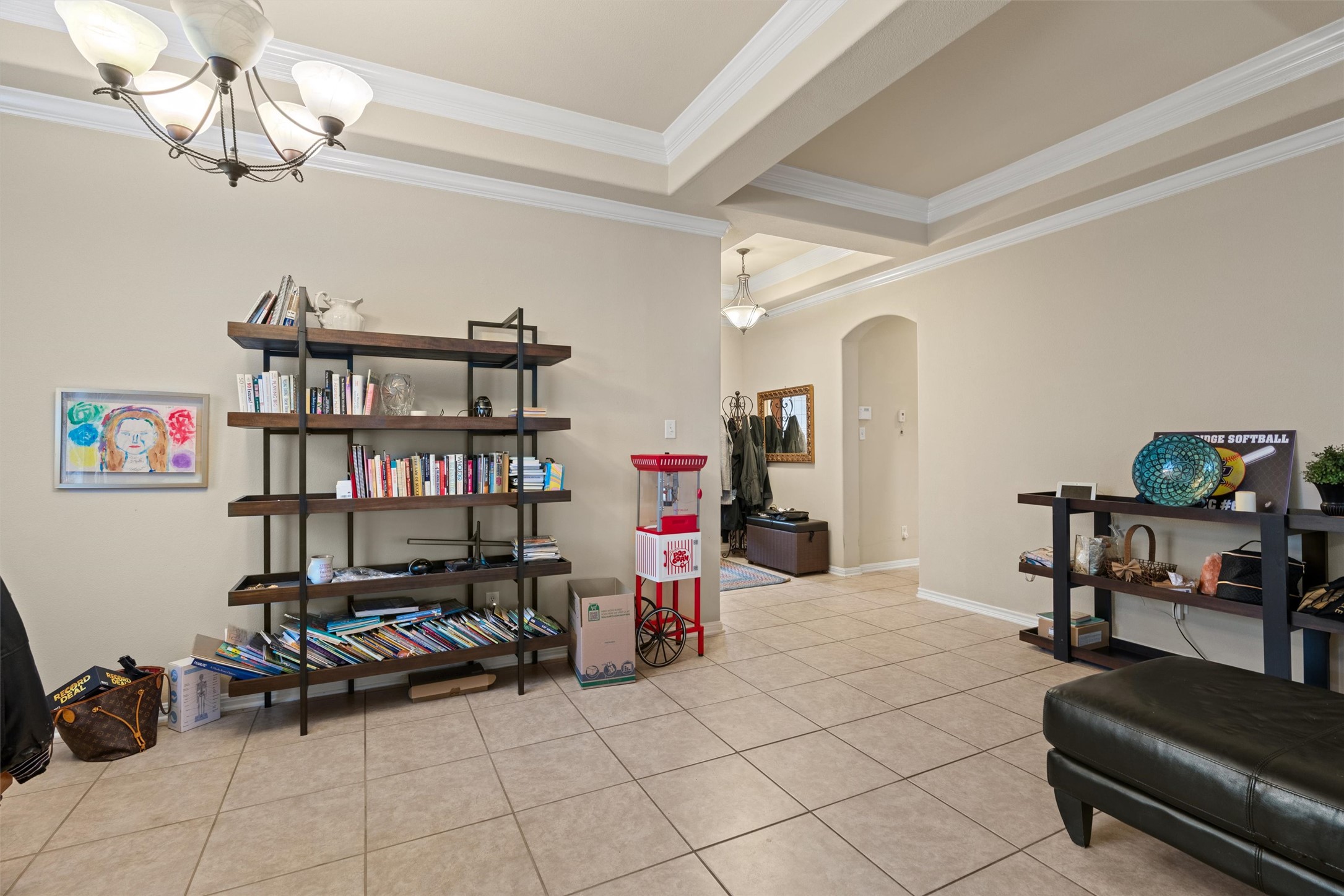 11917 Lansdowne Road Austin, TX 78754 - Photo 3 of 20 This living space features tiled flooring and elegant ceiling details.