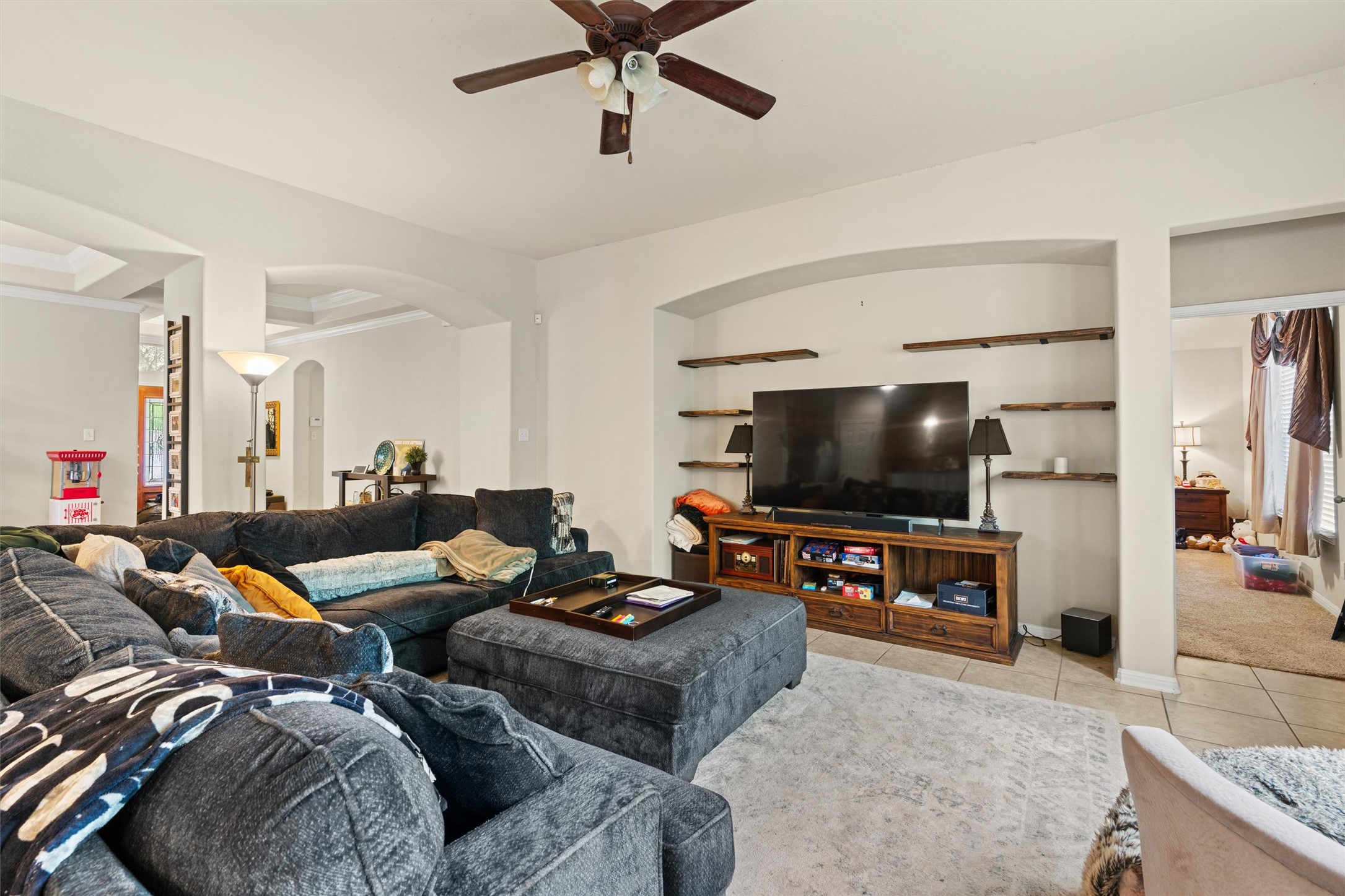 11917 Lansdowne Road Austin, TX 78754 - Photo 4 of 20 This inviting living space features warm tile and carpeted floors, creating a comfortable and functional environment.