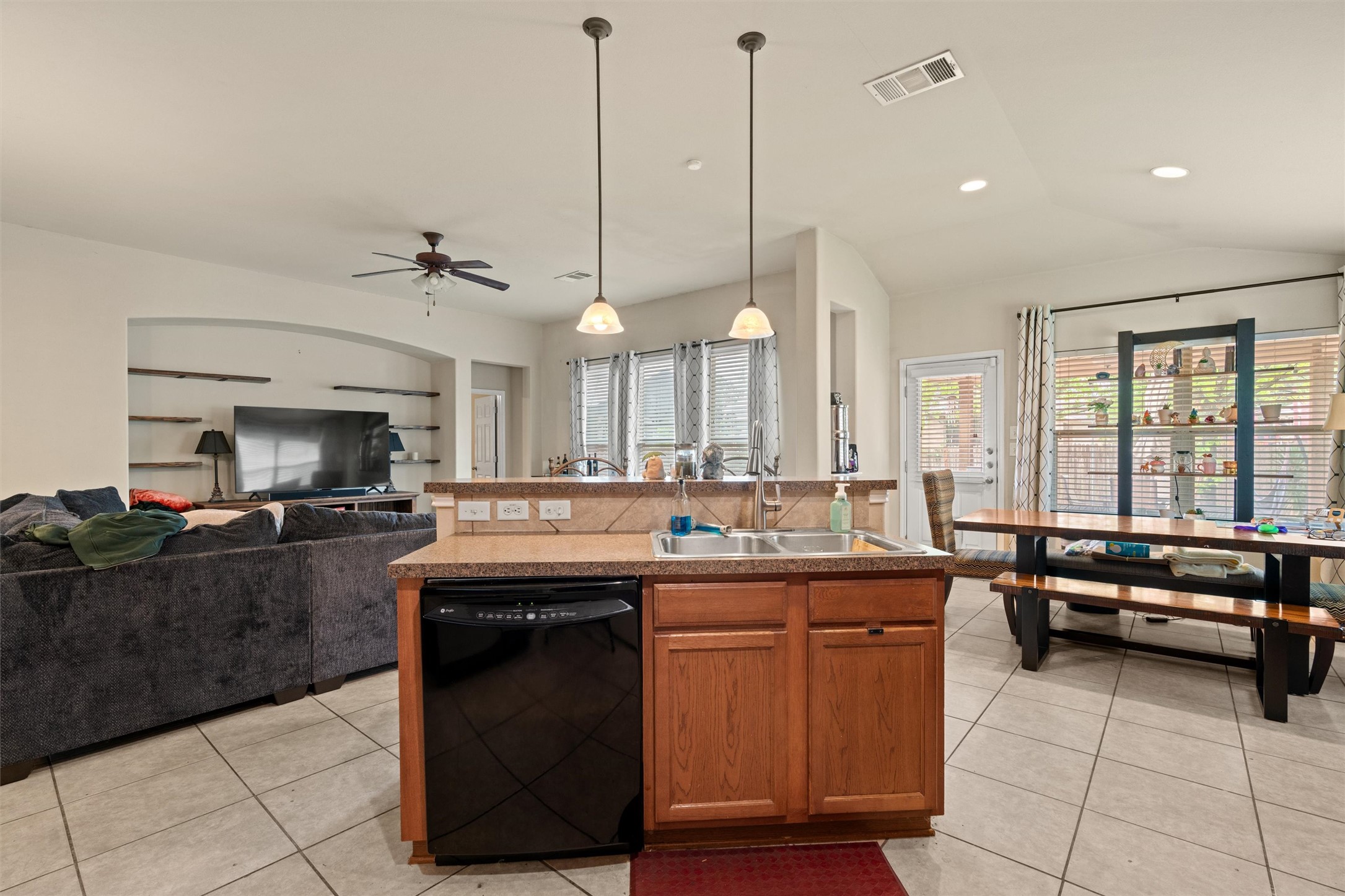 11917 Lansdowne Road Austin, TX 78754 - Photo 8 of 20 This inviting space combines a functional kitchen island with seamless living and dining areas.
