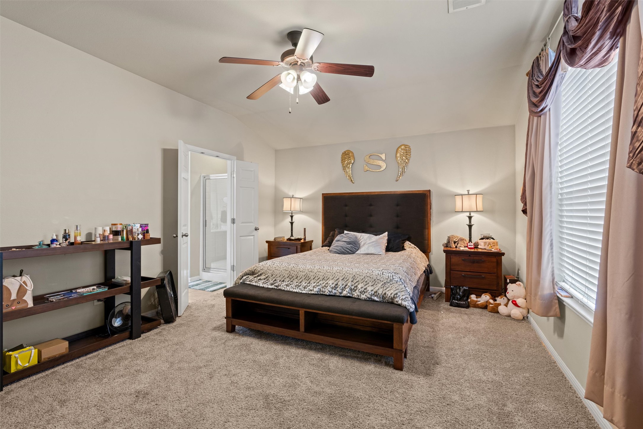 11917 Lansdowne Road Austin, TX 78754 - Photo 9 of 20 This cozy bedroom offers a tranquil retreat with soft carpet flooring and a refreshing ceiling fan.